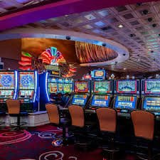Filipino player on mobile phone accessing joyph live casino baccarat table